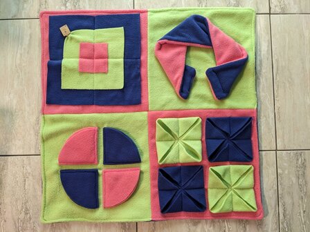 Snuffle rug with 4 puzzles